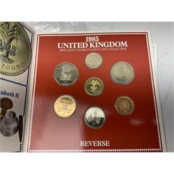 Great British and World coins and banknotes, including United Kingdom 1985 brilliant uncirculated coin collection, two 1995 brilliant uncirculated two pound coins in card folders, commemorative crowns, King George VI 1951 Festival of Britain crowns in card cases, United States of America 1964 Kennedy half dollar, two Switzerland 1966 five franc coins, five German 1972 commemorative coins, Euro banknotes, Bank of England Somerset one pound 'DU27', Japanese banknotes etc
