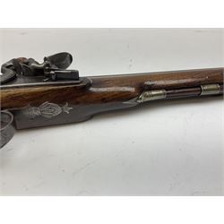 Early 19th century flintlock 16-bore overcoat/duelling pistol by William Bond Lombard Street London, the 23cm octagonal brown stub twist damascus barrel with small foresight, two barrel pins and ram rod under, inscribed Lombard Street London to the top and W. Bond to the action, full walnut stock with lightly engraved steel furniture, pineapple finial and escutcheon, half cock facility L39cm; loose mounted on later mahogany display stand with trade label