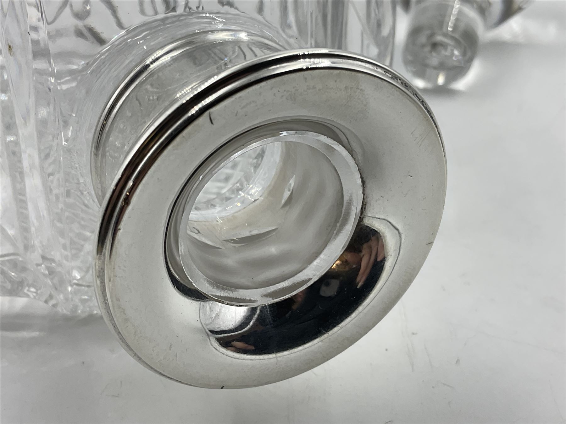 Modern silver mounted glass decanter, the cut glass body of circular form, with personal engraving, the silver collar hallmarked L J Millington, Birmingham 2008, overall H23.5cm