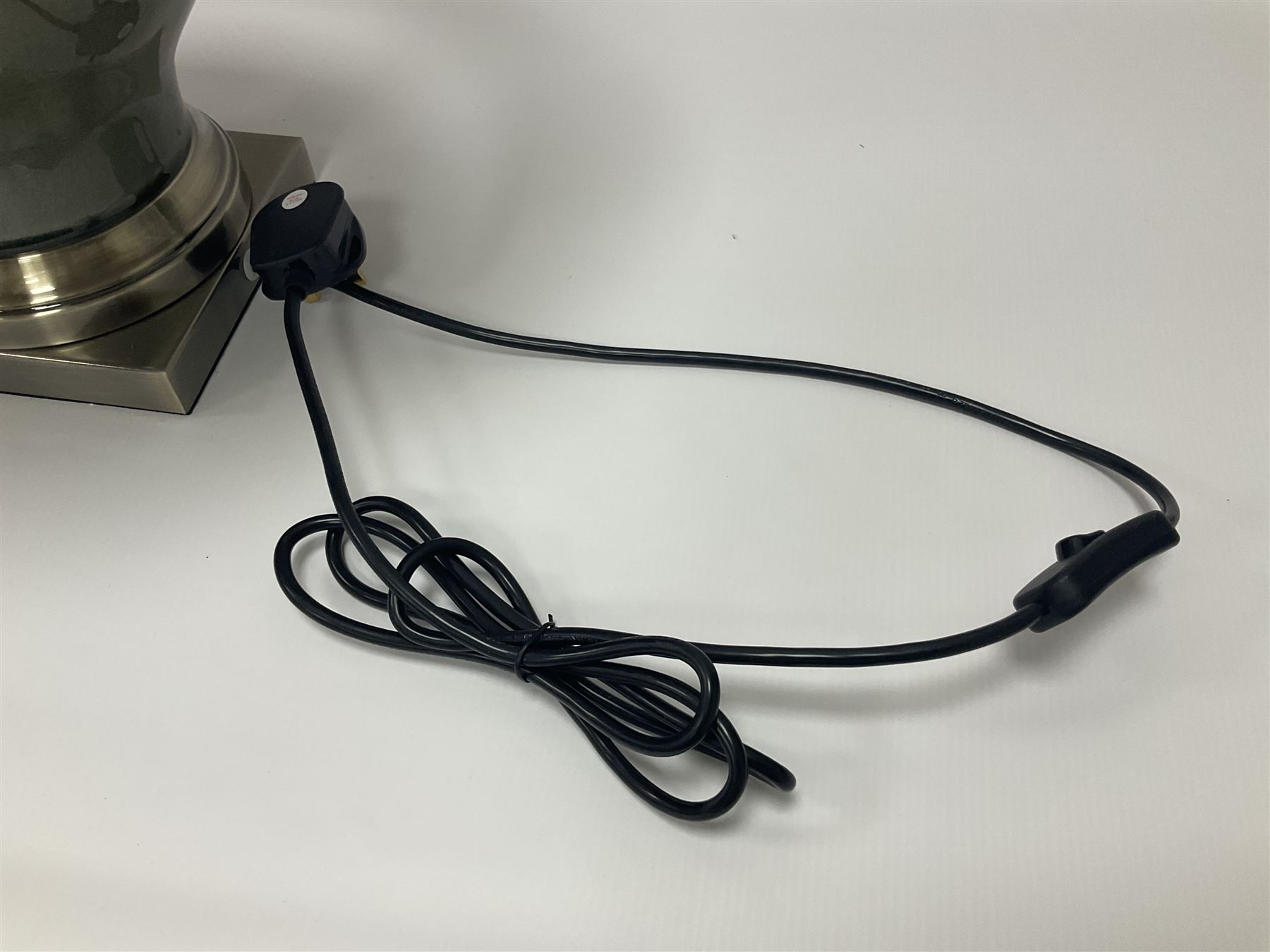 Pair of table lamps of squat baluster form, with a crackle glaze to a dark grey ground, upon a square base, including shade H57cm