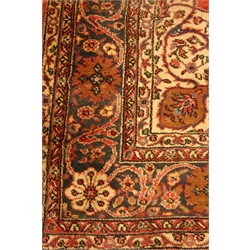  Large Persian Kashan plum ground rug carpet, large central medallion, field decorated with stylised floral motifs, scrolled repeating blue border, beige floral spandrels, 350cm x 258cm  