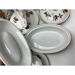 Royal Worcester Evesham pattern tea and dinner wares, to include, three covered tureens of various sizes, coffee pot, two lidded pots, tea cups and saucers of various sizes, two egg cups, round serving platter, five dinner plates, large jug, pair of napkin rings, salt and pepper etc (72)