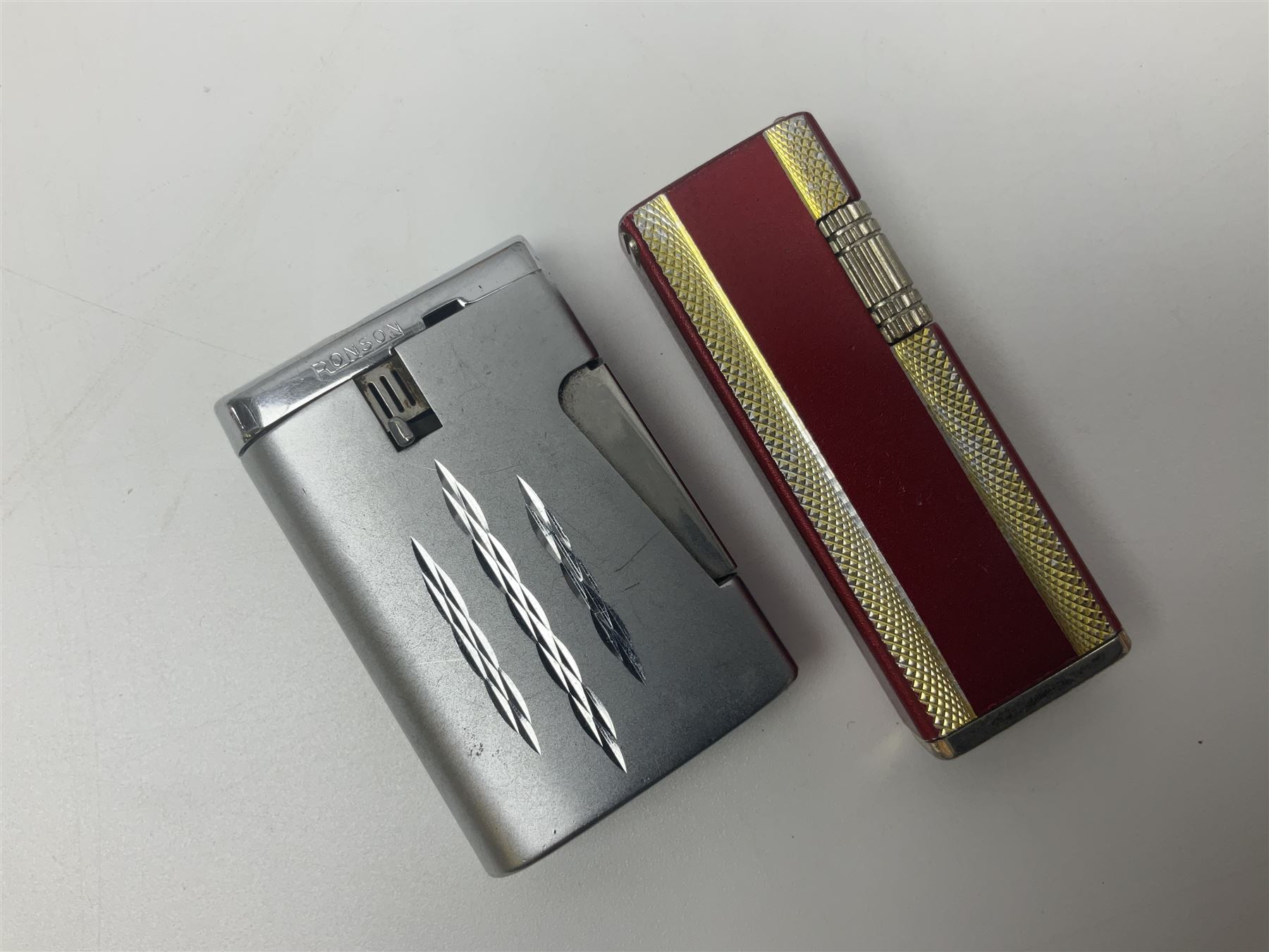 Seven pen knives, two lighters, including one Ronson example and a collection of postcards
