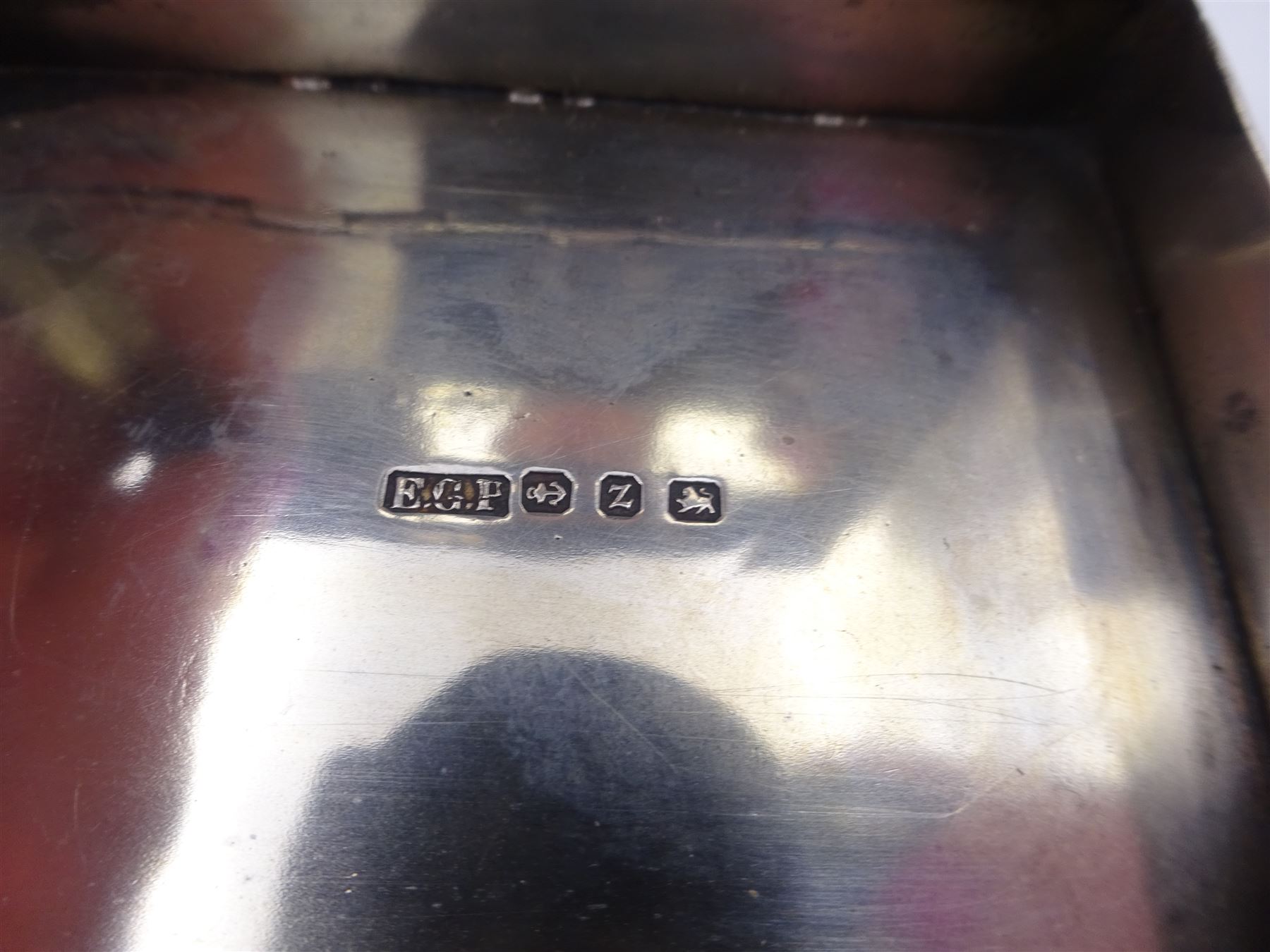 Late Victorian silver snuff box, of rectangular form, engraved with flowers and scrolls, within geometric borders, hallmarked Eustace George Parker, Birmingham 1899, stamped beneath Pearce & Sons Silversmiths, Leeds, W7.6cm