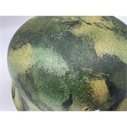 Fully restored German steel helmet, the camouflage painted exterior with two decals and replacement leather liner