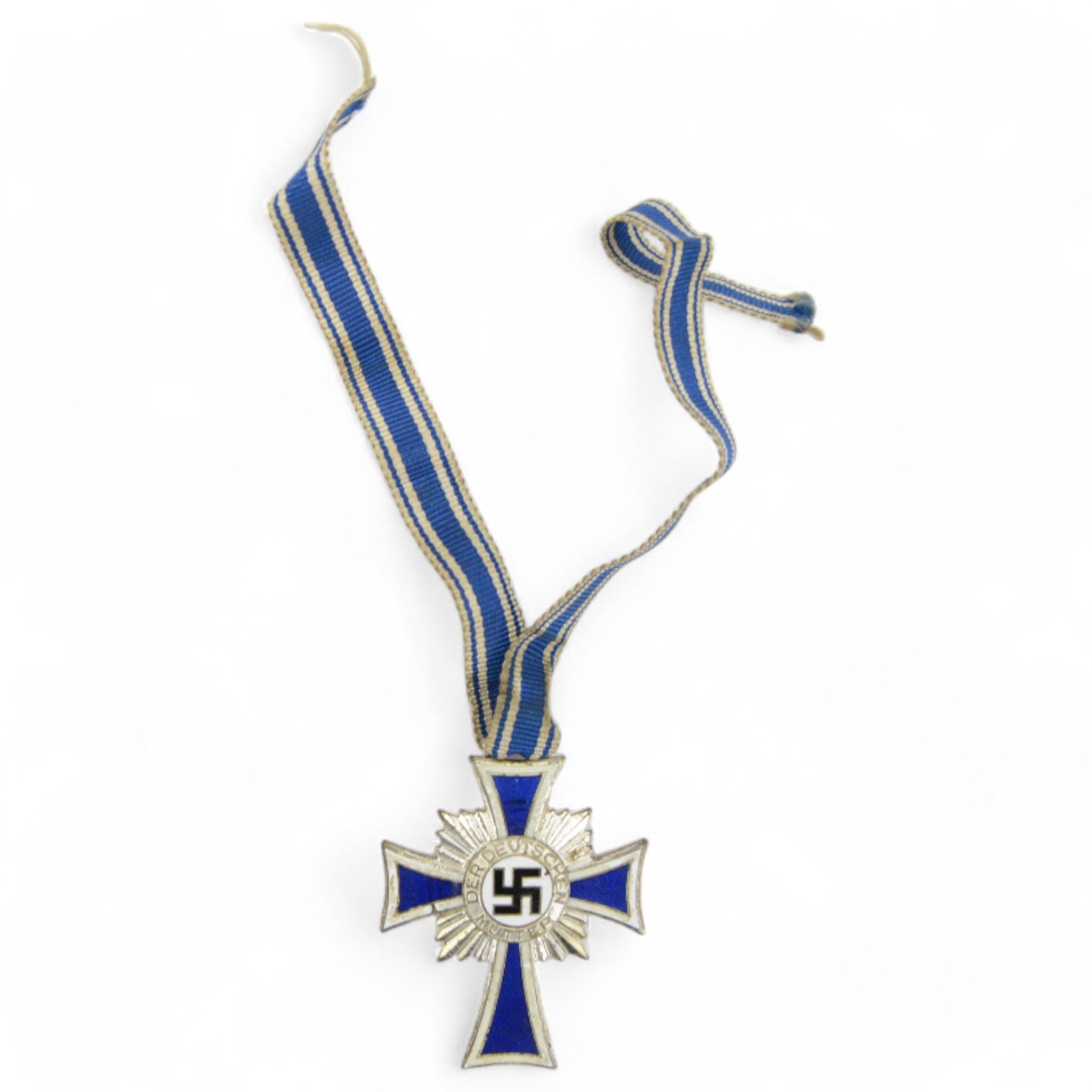 German Cross Of Honour Of The German Mother silver with ribbon, together with War Merit Medal 'fur kriegs verdien 1939' and Hitler youth badge