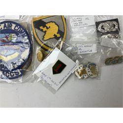 American patches and badges, including para wings, USS Constellation, Strategic Air Command, U.S. military academy, health service regt, Navy Seals, Air Defence Command, Seventh Fleet, various collar badges etc