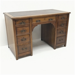  Edwardian oak twin pedestal desk, inset leather top, nine graduating drawers, stile supports, W122cm, H78cm, D63cm  