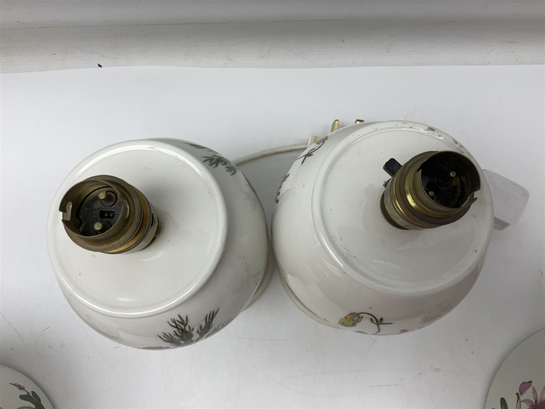 Two Portmeirion Botanic Garden table lamps, together with two Portmeirion Botanic Garden planters