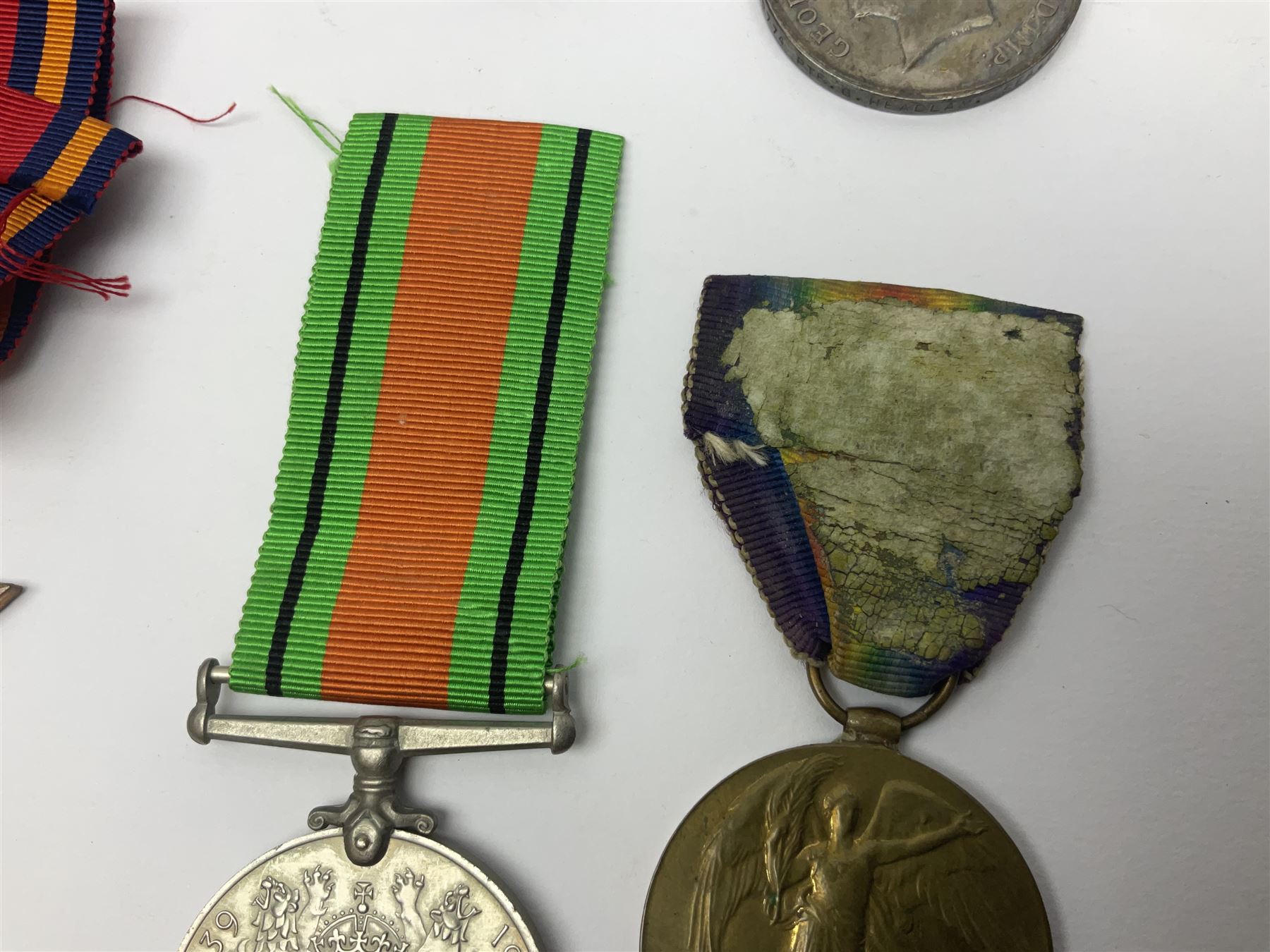 WW1 pair of medals comprising British war medal and Victory Medal awarded to 19774 Pte. G. Headlam Sea. Highrs.; another WW1 pair of medals comprising British War Medal and Mercantile Marine Medal awarded to Charles Filburn; WW2 group of five medals comprising 1939-45 War Medal, Defence Medal, 1939-45 Star, Africa Star and Burma Star; in issue box addressed to Mr. H, Smithson with medal slip; all with ribbons; and Edward VIII Coronation medal (10)