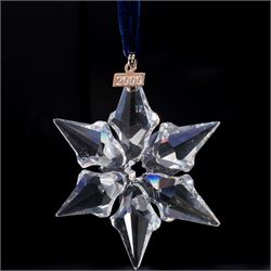 Nine Swarovski crystal snowflake Christmas ornaments, comprising years 1999-2005, 2010 and 2011, some with certificates, boxed (9)