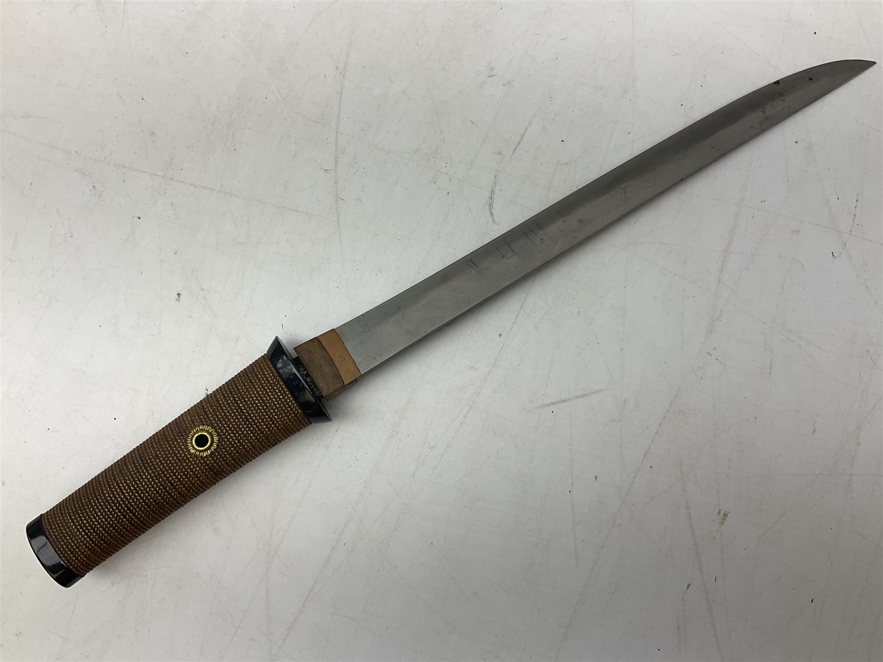 Japanese Tanto with 28.5cm steel blade and cord bound grip; in red spotted black lacquer saya containing a kogai knife with etched characters to the blade and ornate fern leaf and snake handle