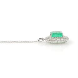 Platinum Colombian emerald and diamond pendant necklace, single octagonal cut emerald of 7.38 carat, surrounded by round cut diamonds in a fancy milgrain pierced design setting, stamped Pt 950, on a trace link chain necklace, total diamond weight 1.14 carat, with GCS certificate