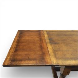 Titchmarsh & Goodwin - stained oak draw leaf dining table, raised on turned supports with H-stretcher, extends to 273cm