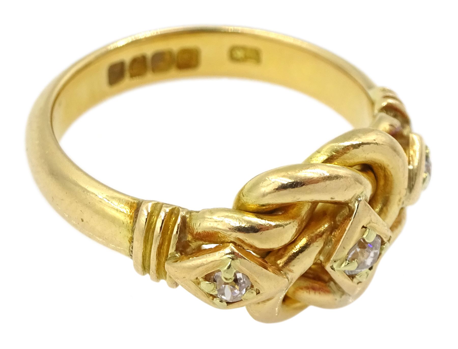 Edwardian 18ct gold three stone old cut diamond love knot ring, maker's mark EK, London 1903