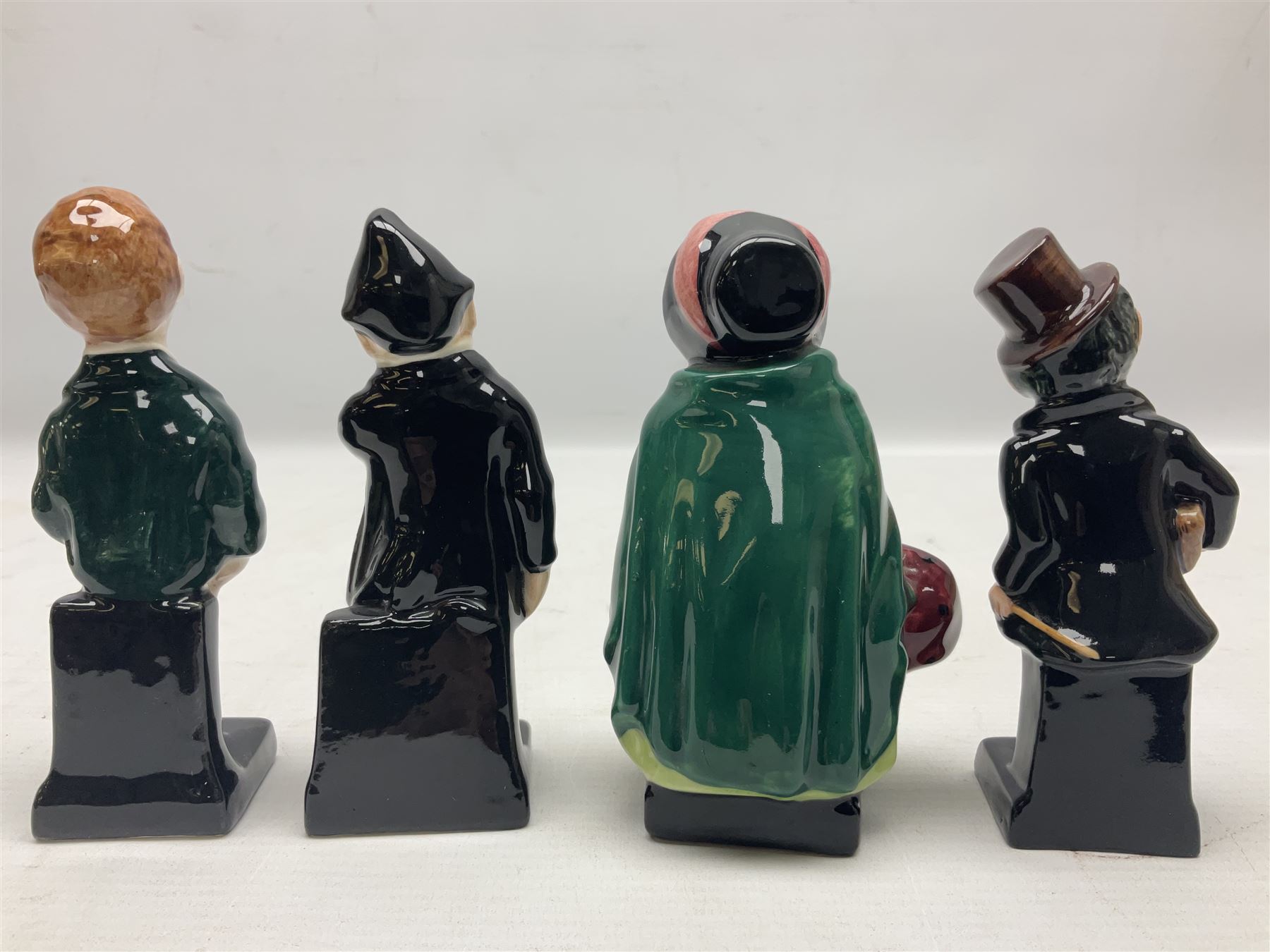 Sixteen Royal Doulton Charles Dickens figures, to include Oliver Twist, Fat Boy, Fagan, Stiggins etc, all with printed marks beneath