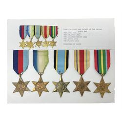 Representative display of WWII Campaign stars comprising 1939-1945 Star, Atlantic Star, Air-Crew Europe Star, Africa Star and Pacific Star; together with the corresponding group of miniatures; all with ribbons