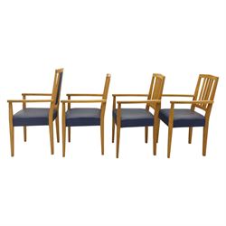 Modern twelve oak dining chairs including one 'Chairmans' chair, solid oak construction, slatted back and arm rests, blue leatherette padded seat, on tapered square supports 