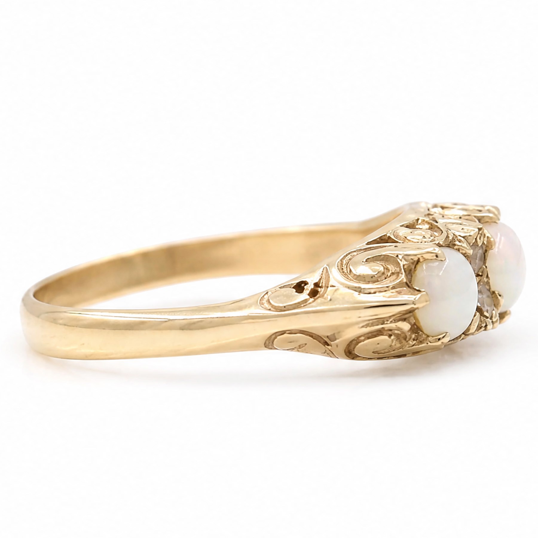 9ct gold three stone opal ring, with four diamond accents set between, Birmingham, 1971