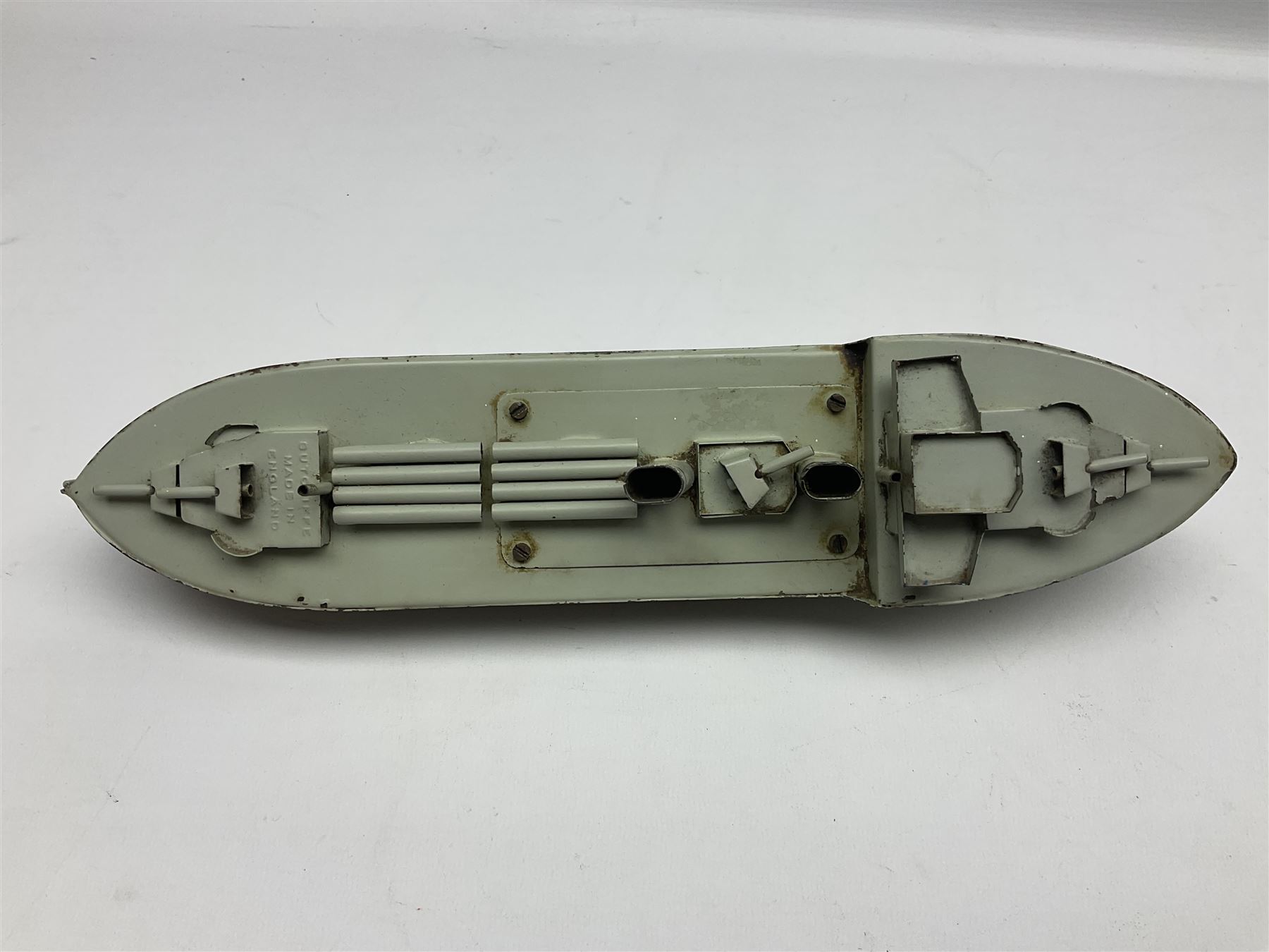 Pre-war Sutcliffe Grenville tinplate clockwork Battleship, with black and grey hull, grey deck and upper decks, propeller and rudder, length 32cm; with manuscript biographical details and two keys, unboxed