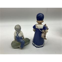 Two Royal Copenhagen figures, Else with teddy, no 671, and boy seated on a marrow no 4539 together with two Royal Copenhagen plates 