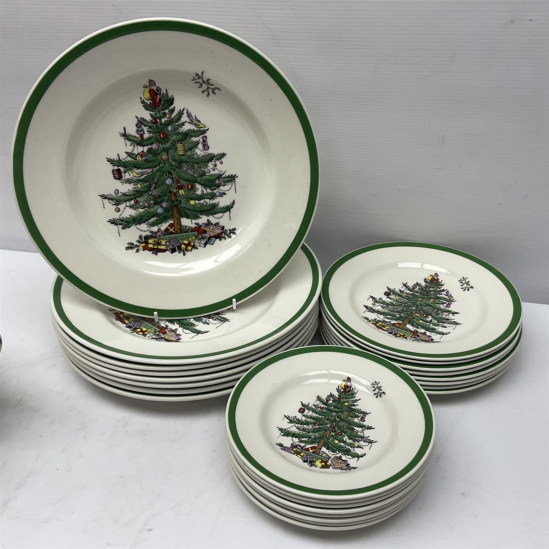 Collection of Spode Christmas Tree pattern part dinner service, comprising three covered tureens, eight dinner plates, eight side plates, eight dessert plates, sauce boat and saucer and serving platter (30)