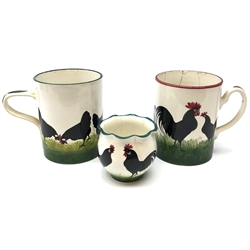  Late 19th century Wemyss tankard painted with a continuous band of Chickens and green borders H14.5cm, a matching tankard with puce borders and vase with waved rim, H9cm (3)  