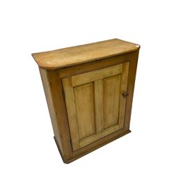 Pine standing cupboard, rectangular top with canted corners, fitted with single panelled door enclosing two shelves