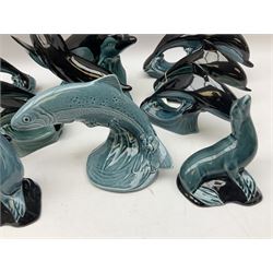 Collection of Poole pottery dolphins,  sea lions, and fish figures, tallest H23cm