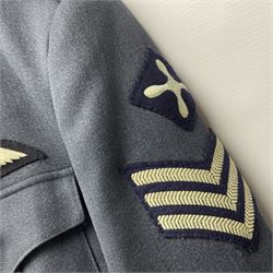 Two post-WWII British Army No.2 Dress tunics, one with Green Howards buttons; army shirt dated 1951; Royal Fleet Auxilliary jacket with trousers; three RAF/WAAF uniforms and RAF Greatcoat; and three canvas/webbing bags, two dated 1943 & 1945