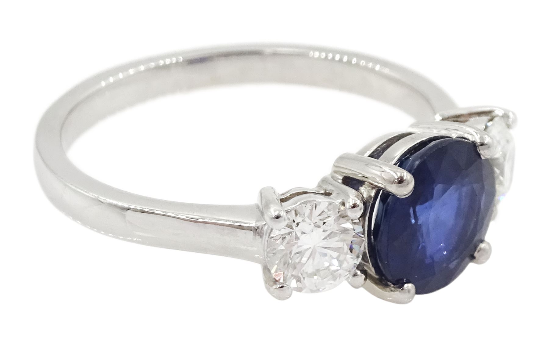 Platinum three stone sapphire and round brilliant cut diamond ring, sapphire approx 1.40 carat, total diamond weight approx 0.65 carat