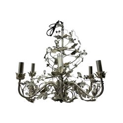 India Jane - silver finish metal chandelier, modelled with scrolling vines and leaves, embellished with faceted glass drops, fitted with six candle sconces, and wired for electricity
