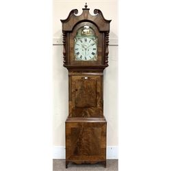 19th century mahogany longcase clock, the hood with scrolled pediment above turned pilasters enclosing stepped arch glazed door, concaved figure frieze over a shaped trunk door, shaped apron and bracket feet, the enamel Roman dial painted with lake and ruin scene with windmills, signed 'T. Lister, Halifax', eight-day movement striking on bell