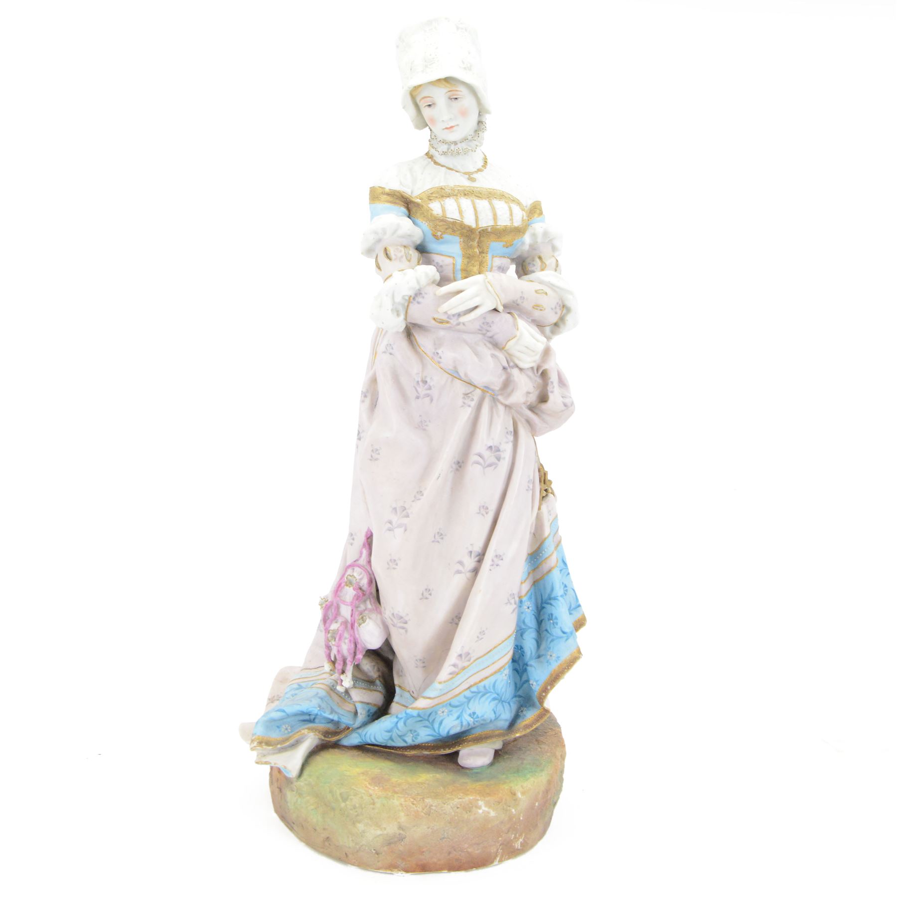 Large late 19th century French bisque figure, in the manner of Jean Gille, modelled as a female figure in high neck floral gown and bonnet, upon a naturalistically detailed circular base, overall H65.5m
