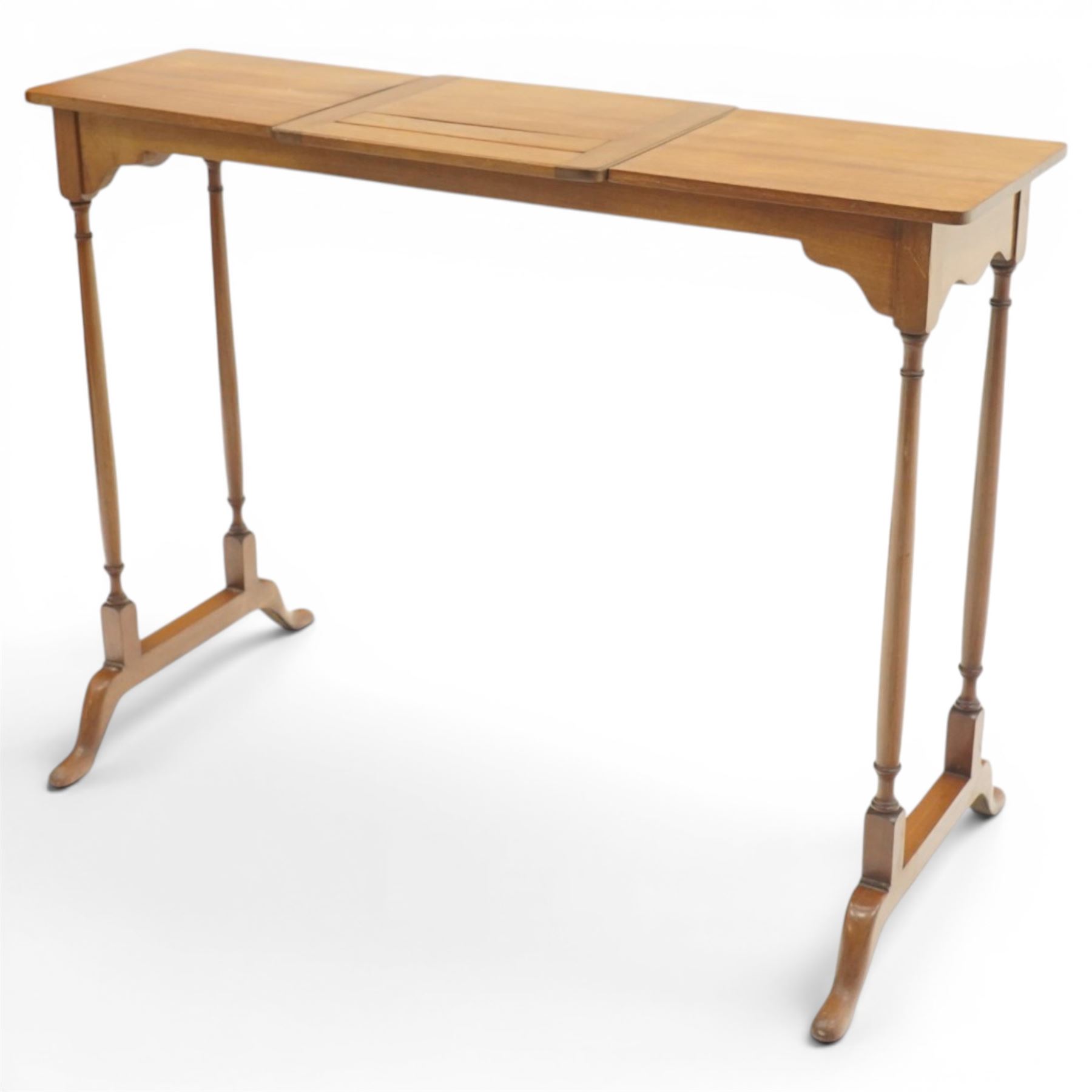 Edwardian mahogany reading stand, rectangular adjustable book rest with hinged ledge, flanked by rectangular side shelves, on slender turned twin end supports with splayed feet