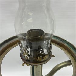 William H Honey polished brass adjustable student's oil lamp, with green glass shade, H60cm