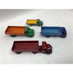 Dinky - seven unboxed and playworn/repainted die-cast commercial vehicles comprising Bedford Articulated lorry, Leyland Comet, Big Bedford, Ford 800 tipper truck, Guy flatbed and planked flatbed lorries and Dodge tipper truck (7)