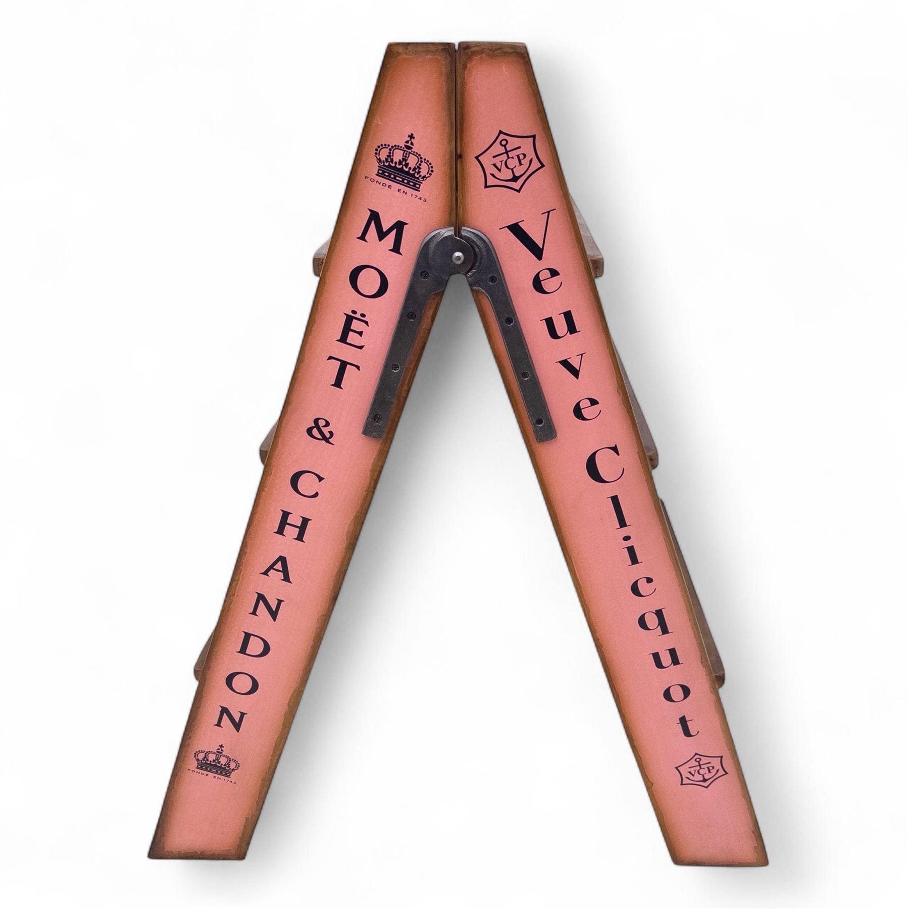 Three-piece champagne advertising display set, comprising pine steps with painted Dom Pérignon and Bollinger lettering, and two wooden boxes branded Moët & Chandon and Veuve Clicquot (Steps H 80cm, W 44cm, D 68cm, crates each H 18cm, W 44cm, D 26cm)