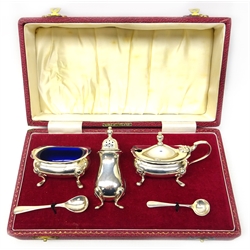  Silver three piece condiment set with spoons and blue glass liners  Birmingham 1970 cased, 3.5oz  