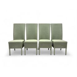 Set of four Lloyd Loom dining chairs, each with woven high back and seat in sage green finish, raised on matching painted tubular supports