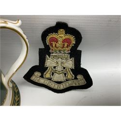 Limited edition Spode Green Howard's twin handled loving mug, no 205/300, with certificates, together with a Green Howards cased Tercentenary medal (1688-1988), cap badge and embroidered patch, largest H11.5cm