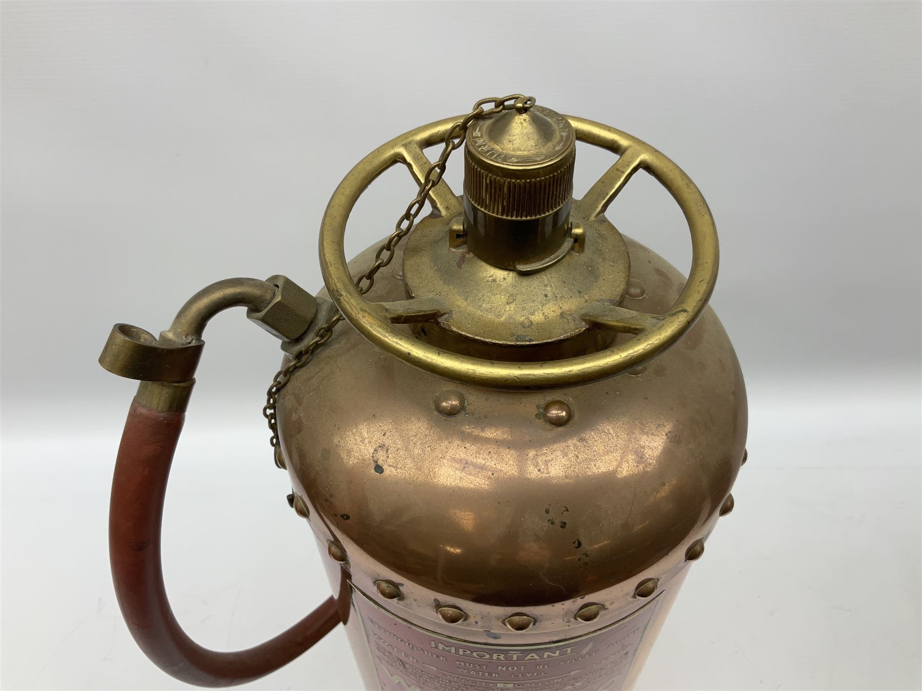 Large copper ‘Waterloo’ fire extinguisher by Read and Campbell Ltd and another Safex example 
