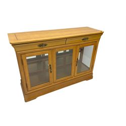 Yew wood sideboard, rectangular top with mahogany and ebony stringing, fitted with two drawers over three glazed cupboard doors enclosing glass shelves
