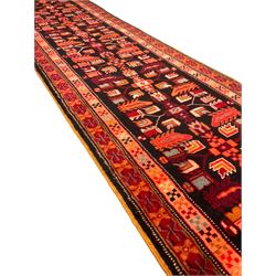 North West Persian Heriz runner, dark indigo ground field decorated with Herati motifs, peach and red borders with geometric design 