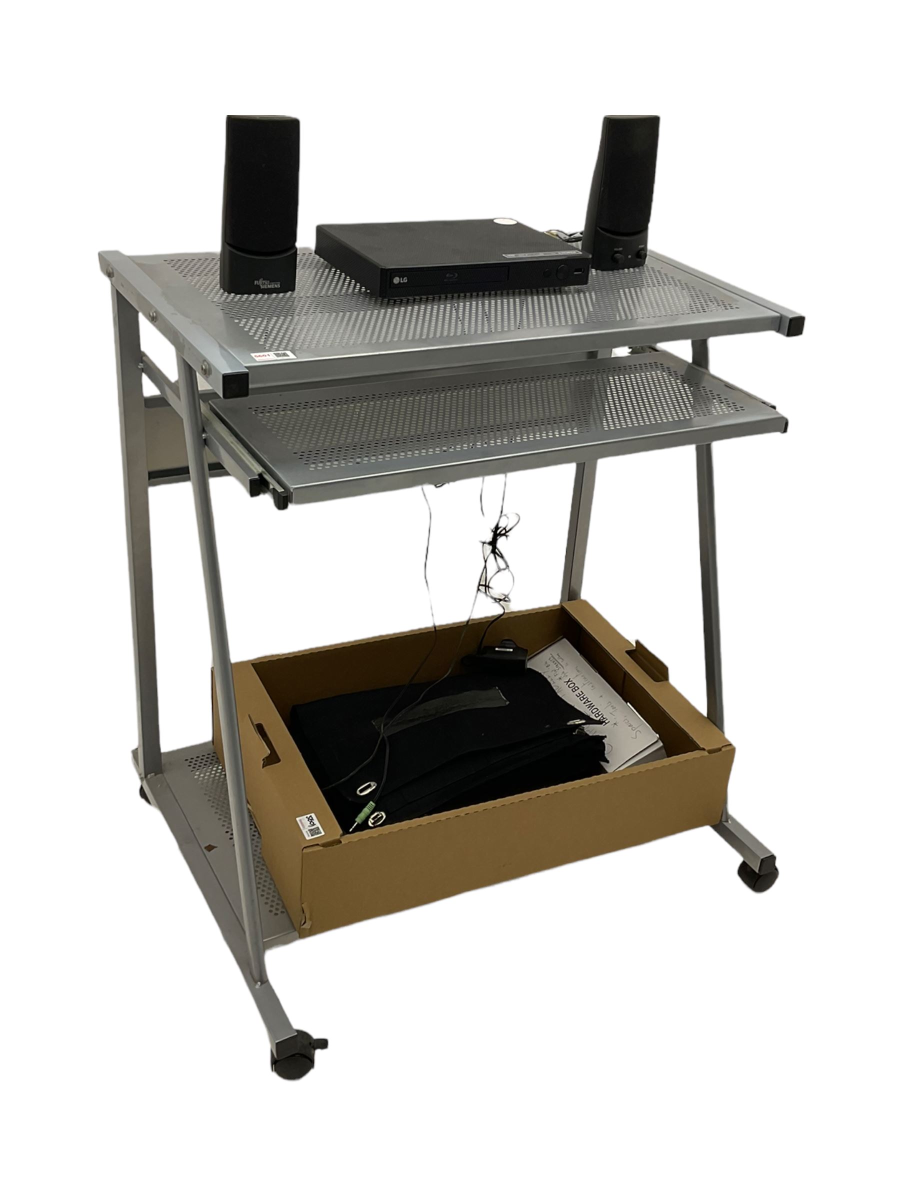 LG BP250 Blu-ray player, Sony floppy disk drive, pair Fujitsu speakers and various cables on computer stand