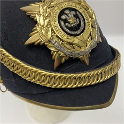 Post-1902 Welsh Regiment Officer's Home Service Blue Cloth Helmet with gilt metal King's crown helmet plate to the front, a removable spike to the top on a shaped cruciform base with rosette fittings, rosette side bosses, brass trim to the front peak, and leather and velvet backed chin scales, with sweat band, the interior with the remains of a makers label at the address 1,3 & 5 Lexington Street, Golden ? London W (presumably Hobson & Sons)