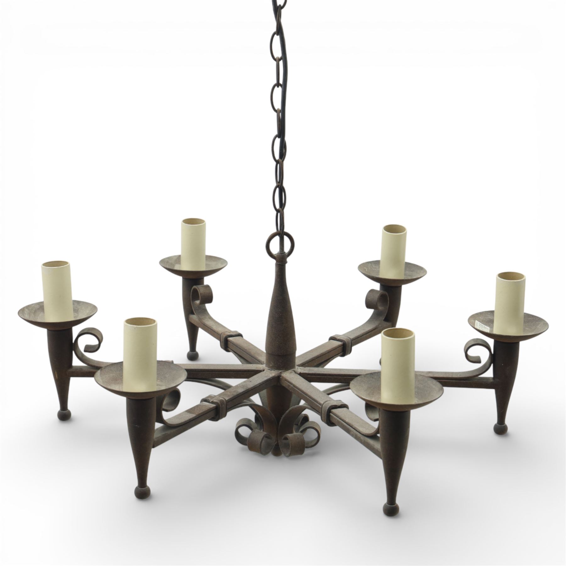 20th century wrought iron six branch chandelier, the central baluster stem issuing six scrolling arms supporting circular drip pan with drop terminals