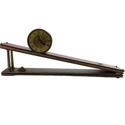 Dent incline plane clock, a 1970’s replica of a 17th century gravity clock manufactured by Dent of London in limited edition numbers, continuous lever balance movement driven with an internal counterweight, brass drum case with a gilt dial and silvered chapter ring, Roman numerals, engraved sunburst centre and pierced steel hands, inclined base with a red leather tooled top and the seven days of the week engraved to the front. With 500 limited edition certificate, No 154.
