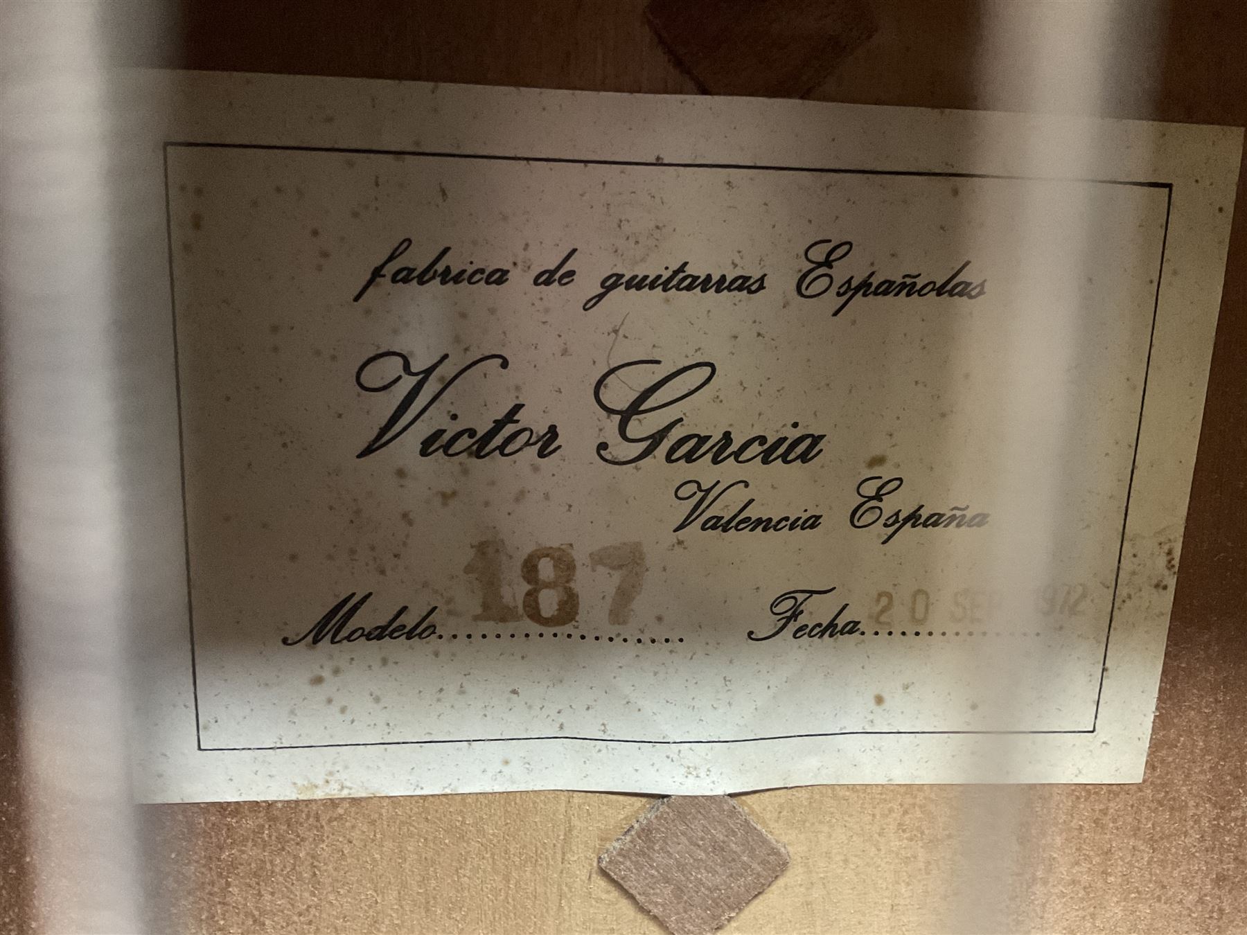 Encore black electric cut-away guitar L96cm; and Spanish Victor Garcia model 187 acoustic guitar, bears label dated 1972 L99cm; each in soft carrying case (2)