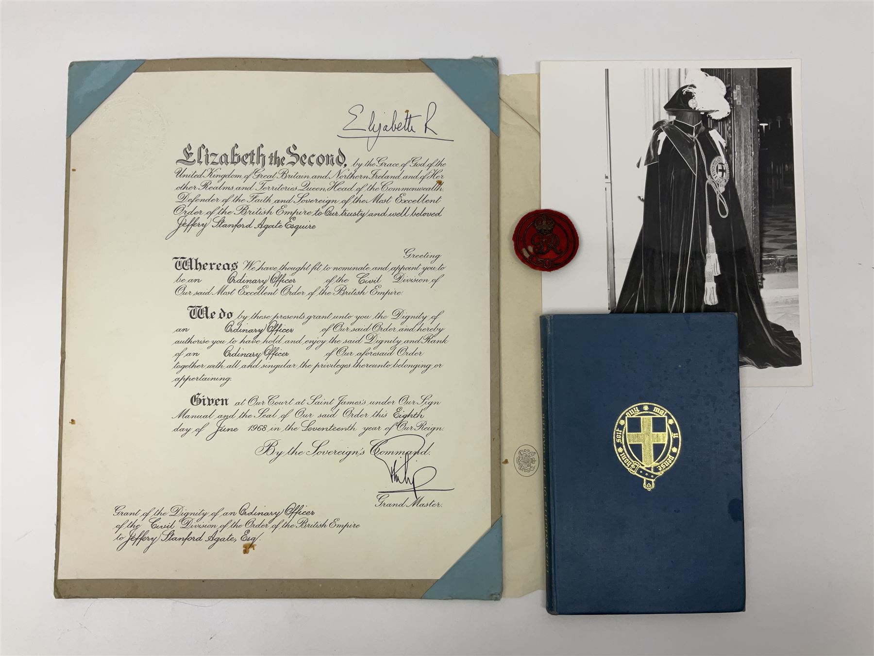 George VI Knight of the Garter cloth beret insignia with pin back and photograph of the Knight's Robes; Edmund Fellowes book on The Knights of the Garter 1348-1939; together with EIIR civilian OBE certificate to Jeffery Stanford Agate with facsimile signatures of Elizabeth II and Prince Philip